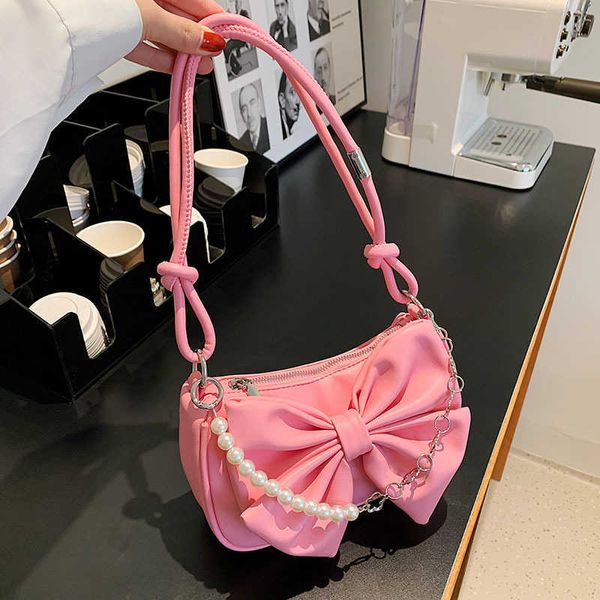 Sacs à bandoulière avec nœud papillon et chaîne de perles, sac sous les bras pour femmes, nouvelle niche de Style fille tendance et épicée haut de gamme, bandoulière unique