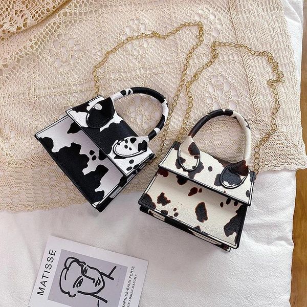 Sacs à bandouliers PU Leather mini sac à main pour les femmes 2024 Designers de luxe Portefeuilles Fashion Migne Cow Pattern Printing Chain Crossbody