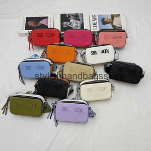 Schoudertassen stoffen zakken handtassen nieuwe trend gepersonaliseerde massieve kleurcamera tas modieuze en eenvoudige handheld crossbody H240417