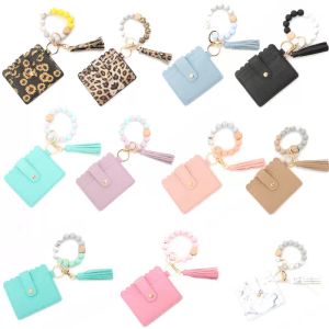 Pulsera de cuentas de silicona Bolsa de tarjeta de leopardo con cuentas de madera Llavero de borla de cuero de PU Cartera portátil para damas con broche DHL