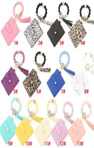 Bracelet de perle en silicone faveur Sac de carte de léopard en bois perle en cuir PU Tassel portefeuille portable portable portefeuille avec Snap Party Suppli2704724
