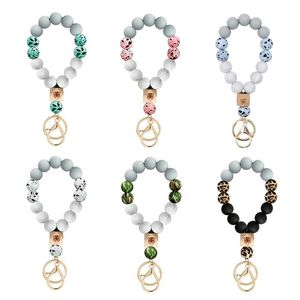 Cuentas de silicona Pulsera Llavero Anillos Mariposa Grano de madera Camuflaje Encanto Muñeca Coche Llavero Titular para hombres Moda Mujer Bolsa Joyas Regalos Accesorios 6 colores