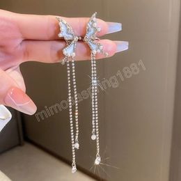 Pendientes de Clip de mariposa de Color plateado con incrustaciones de diamantes de imitación pendientes largos de borla de perla simulada para mujer
