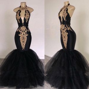 Zwarte prom -jurken met gouden kanten decoratie Mermaid Halter Neck Sweep Train Zuid -Afrika Stijl Formele avond Gedeelte feestjurken