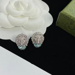 Boucles d'oreilles clous tête de lion strass argent. Bijou de charme bleu clair. Créateur de boucles d'oreilles de luxe rétro pour femme. Marque de mode créateur de bijoux fête de mariage mariée aretes