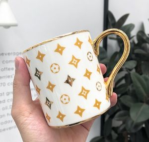 Tasse en céramique à poignée dorée, Simple, personnalisée, tendance, légère, de luxe, cadeau de bureau, tasse à café, tasses de mariage