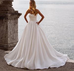 Eenvoudige mouwloze trouwjurk 2024 Strapless Pockets Satin A-Line Women Bruid Jurk Beach Princess Vestido de Noiva