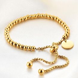 Eenvoudige roestvrijstalen goud-zilveren kralenarmband met ronde hanger. Kettingarmband. Mode ronde tag. Verstelbare ronde kralenarmband