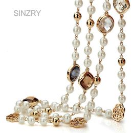 SINZRY koop Cubic zirkoon rose bloem gesimuleerde parel lange ketting voor vrouwen trui winter ketting kerstcadeau 240220