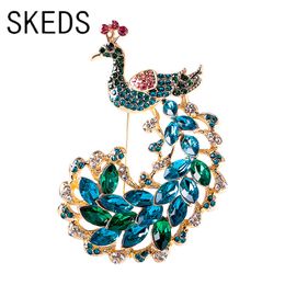 SKEDS luxe femmes élégant plein strass brillant paon broches Badges dame classique haut de gamme cristal Animal fête mariage broches