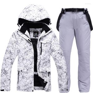 Chaquetas de esquí espesar cálido traje de esquí parejas vestido invierno a prueba de viento impermeable Snowboard chaqueta pantalones conjunto hombres mujeres de talla grande 3XL