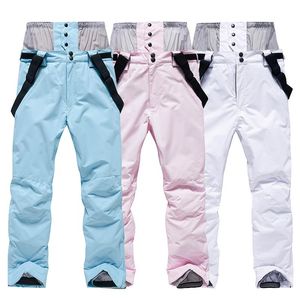 Pantalones de esquí hombres mujeres blanco rosa esquí a prueba de viento impermeable cálido pareja nieve pantalones invierno snowboard con protección de cintura