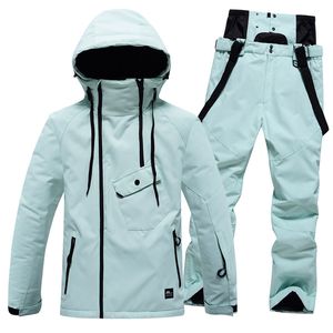 Skipakken Ski-jumpsuit Dames Winterbovenkleding Warm gewatteerd sneeuwpak uit één stuk met capuchon Bontkraagjas Glanzend waterdicht Snowborad-pak J240112