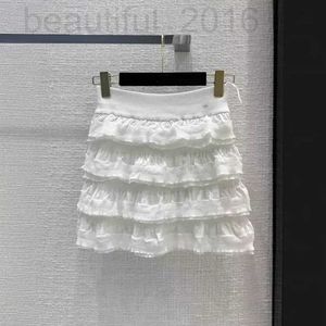 Skirts Designer Shenzhen Nanyou Huo ~ 24 printemps / été nouveau produit petit vent parfumé jupe à gâteau tricoté blanc moitié pour les femmes nxml