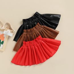 Rokken mode zomer peuter babymeisje mini rok casual elastische taille vaste kleur faux lederen rokje kind kleding 230427