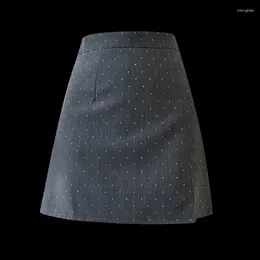 Faldas pesados damond de diamante versátil falda de verano dividido anti respliegas de cintura alta de cintura A-line hip abreviatura de mujeres