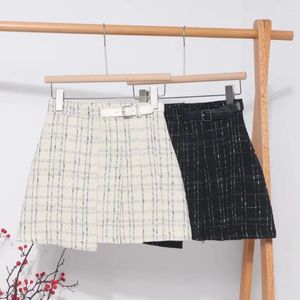 Jupes Mode coréenne Mini jupe pour femmes taille haute Plaid irrégulier hanche chemises automne polyvalent dames court goutte