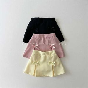 Rokken rokken Koreaanse kinderjongen kleding meisje veer nieuwe massieve kleuren broek shorts geplooide rok tutu rok wx5.21