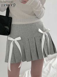 Jupes Skorts Weekeep automne hiver jupe plissée décontracté taille haute mignon nœud cousu lâche Mini jupes pour les femmes mode y2k Harajuku tenues 240330