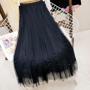 Rokken solide casual tule rok voor vrouwen 2024 zomer mode dames hoge taille geplooide midi vrouwelijke straat zwarte a-line jurk