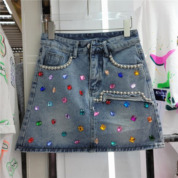 Jupes printemps et été Jeans jupe filles industrie lourde perles diamant paquet hanche Denim pour femmes Sexy Mini 230627