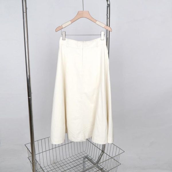 Jupes Femmes hautes hautes A-line jupe midi couleur solide élégante poches de patch féminines uniques longues pour 2024 été