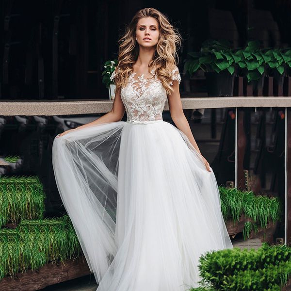 Robes de mariée d'illusion sans manches pour mariée, en Tulle classique, bouton couvert creux, traîne de balayage attrayante, ceinture appliquée, ligne a