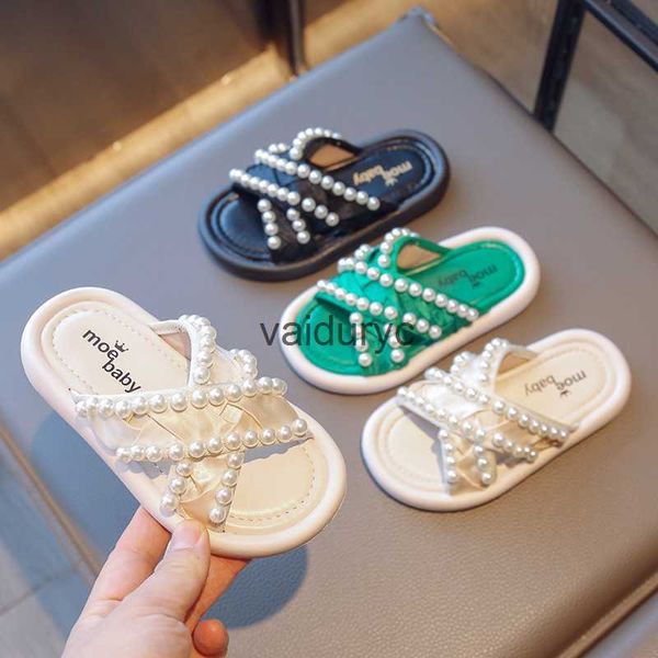 Slipper Girls Summer Slippers 2024 New Little Girl Cross Teaving Ribbon Pearl Princess Shoes Corée Édition externe Externe H240507