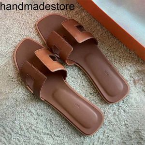 Pantoffel Orans Luxe Klassieke Oranje Pantoffels Sandalen Slippers Zomer Designer Schoenen Koeienhuid Dames Mode Glijbaan Casual Sandaal Buiten Reizen Strand Rubberen zool Dame