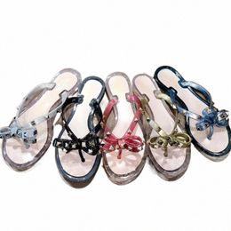 2022 Pantoufles Designer Femmes Sandales Slide Chaussures de luxe en caoutchouc Saule clouté Bows Tongs Jelly Sandal Beach Outdoor