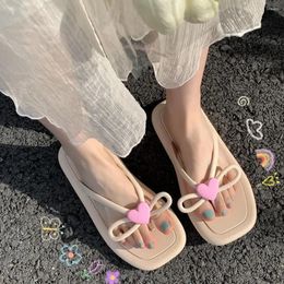 Slippers Abricot plat avec glissades d'arc Chaussures mignonnes pour femmes tongs à la maison Sandales kawaii sur la plage à l'extérieur de la femme rose pvc eva b