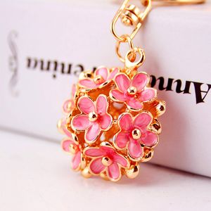Petite fleur de marguerite clé pendentif en métal accessoires sac femmes de la chaîne en trois dimensions ajourées cinq cadeau créatif feuille de porte-clés de fleurs