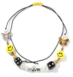 Collier visage souriant Asap Rocky pour femmes, bijoux en alliage, décorations de dés de crâne, thème papillon et poire, cadeau d'anniversaire 6166304