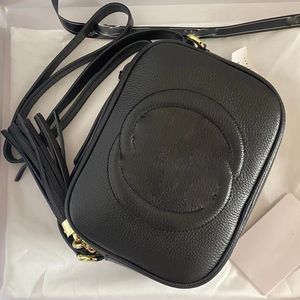 Soho kleine lederen disco tas reliëf in elkaar grijpende G compacte schoudertassen lederen kwastje rits pull luxe designer vrouw crossbody portemonnees portemonnee