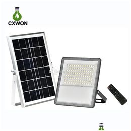 Luces de inundación solares 100W 200W 300W 400W Luces de inundación solares Lente de carcasa de aluminio Cuentas LED Alto brillo Ip65 Luz de pared de seguridad para exteriores Dhhjg