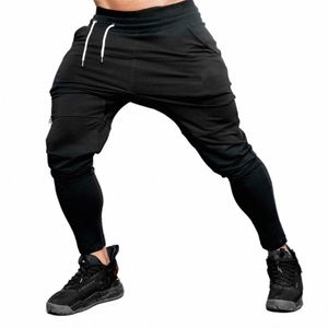 Pantalon de jogging noir solide Gyms Pantalons de survêtement Hommes Casual Cott Trackpants Pantalon d'automne Mâle Fitn Entraînement Sportswear Bas M1CJ #
