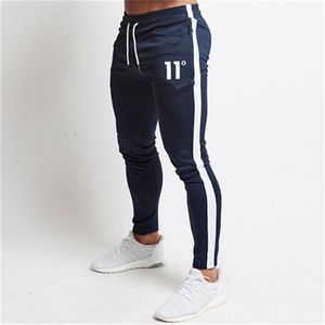 Solide décontracté Hommes Casual Slim Fit Survêtement Sport Solide Homme Gym Coton Skinny Joggers Sweat Pantalon Pantalon 220524