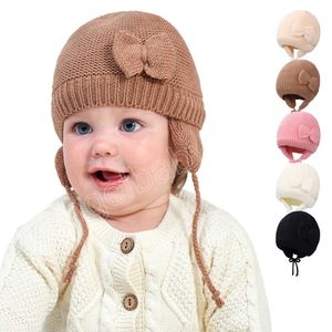 Bonnet de couleur unie pour bébé, bonnet d'hiver chaud avec nœud tricoté pour enfants en bas âge, filles et garçons, chapeau réglable à la mode