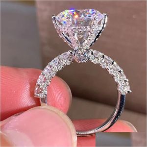 Solitaire Bague De Mariage Ensembles De Bijoux De Luxe Blanc Zircon Cubique Bagues De Fiançailles Pour Les Femmes Sier Couleur Élégante Mariée Partie Accessoire Dhfbm