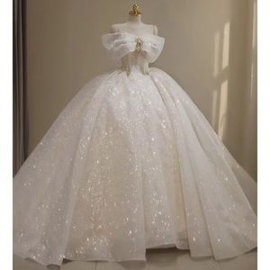 Robe de mariée scintillante en ligne Appliques pailletées Longue blingbling Dubaï Arabie Saoudite Robe de bal Robes de mariée Hors de l'épaule Dos ouvert Robes de mariée