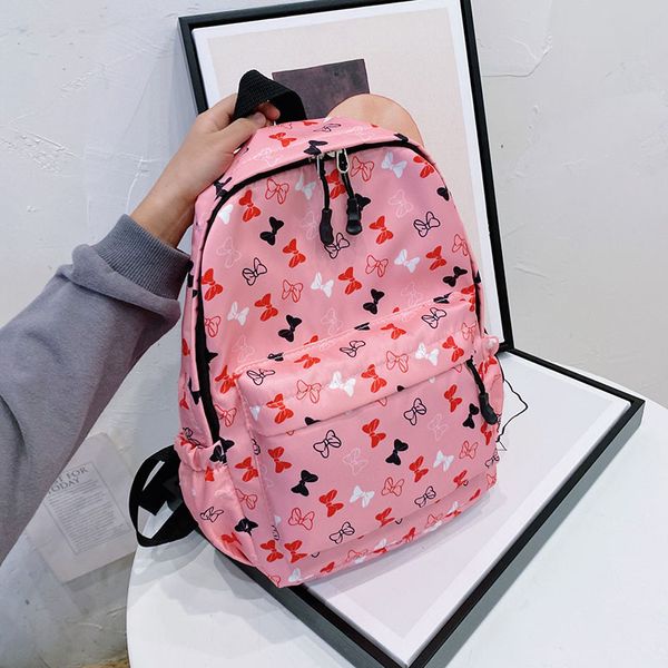 Primavera 2021 nueva moda niños mochila de dibujos animados niños niñas arco alumnos hombros bolsas niños impreso cremallera Casual mochilas C6868