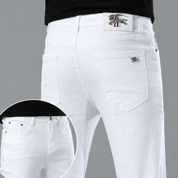 Printemps 2023 Jeans minces pour hommes coréens édition slim slim haut de gamme pantalon de famille blanc pur e européen B