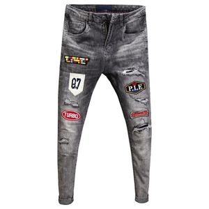 Printemps Automne adolescents hip hop trou Ripped mens hightech brodé patch jeans coréen pieds minces mode pantalon crayon 201111