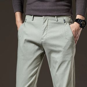 Primavera para hombre pantalones casuales delgados algodón elástico suave transpirable moda coreana pantalones de trabajo de negocios negro caqui verde 240305