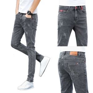 Printemps nouveau jean coréen polyvalent à la mode élastique coupe ajustée petits pieds hommes décontracté pantalons longs pour hommes