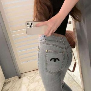 Lente gescheurde jeans designer broek damesmode briefborduurwerk kleine voeten denim broek slanke potloodbroek