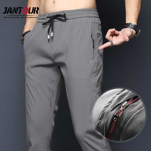 Primavera de primavera de pantalones casuales para hombres delgados chinos de moda delgada calzada delgada cintura elástica pantalones secos de la marca de la marca masculina 210707