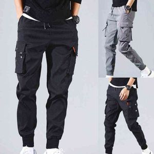 Pantalons de cordon pour hommes du printemps pour hommes Tie Piets Salopes HARAJUKU LIGNE CHELANDE CONTRANGE LANGE CONTRANGE SPORT