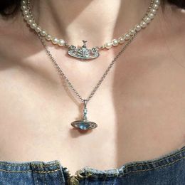 Primavera/verano Nuevo Petulla Agua Azul Beads de vidrio giratorio Conjuntos con diamantes Collar Saturno Luz de mujer Luxury Collarbone Tendencia de la cadena