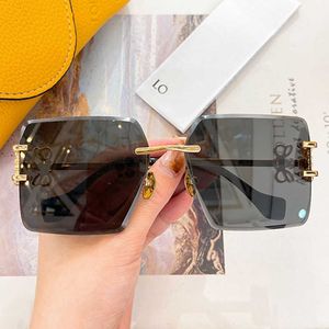 SS24 Dames frameloze vierkante zonnebril HW2057 Nieuwe dames designer metaal zonnebrillen topkwaliteit UV400 lens benen goud metaal luxe designer bril leuk